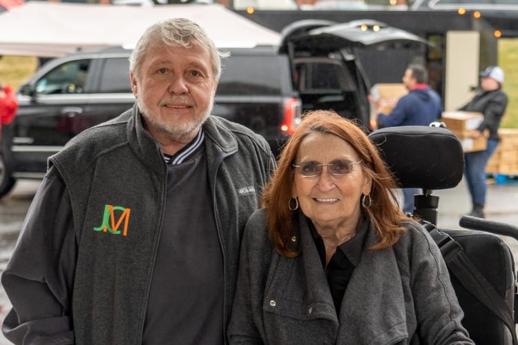 Couple standing together outdoors at an event